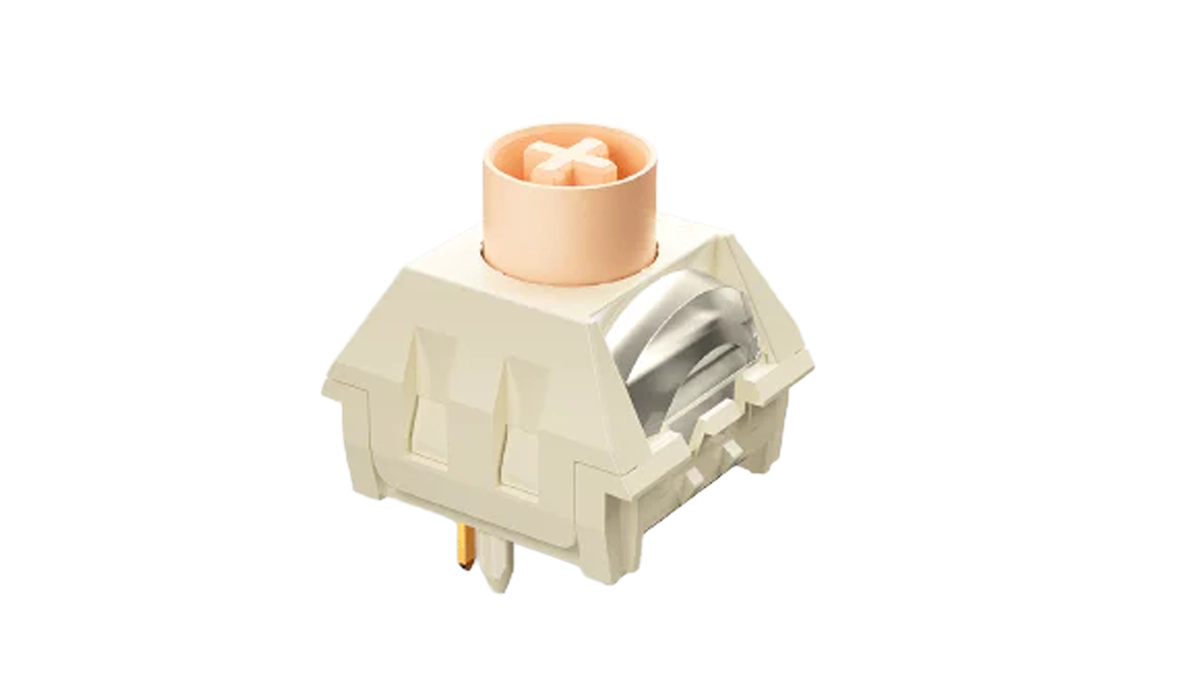 Na zdjęciu widać mechaniczny przełącznik klawiaturowy w kolorze kremowym i pomarańczowym.